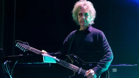 Perry Bamonte, the legendary guitarist and keyboardist of The Cure, passes away